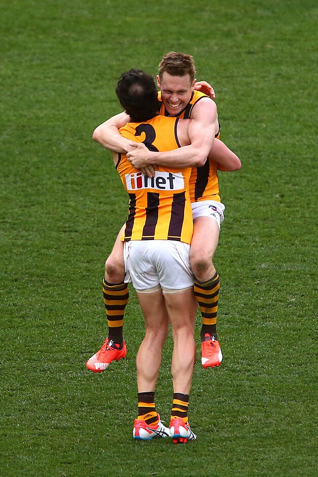2015 Toyota AFL Grand Final - Hawthorn v West Coast MELBOURNE, AUSTRALIA - OCTOBER 3: Sam Mitchell celebrates with team-mate Jordan Lewis of the Hawks after a win during the 2015 Toyota AFL Grand Final match between the Hawthorn Hawks and the West Coast Eagles at the Melbourne Cricket Ground, Melbourne, Australia on October 3, 2015. (Photo by Rob Prezioso/AFL Media)